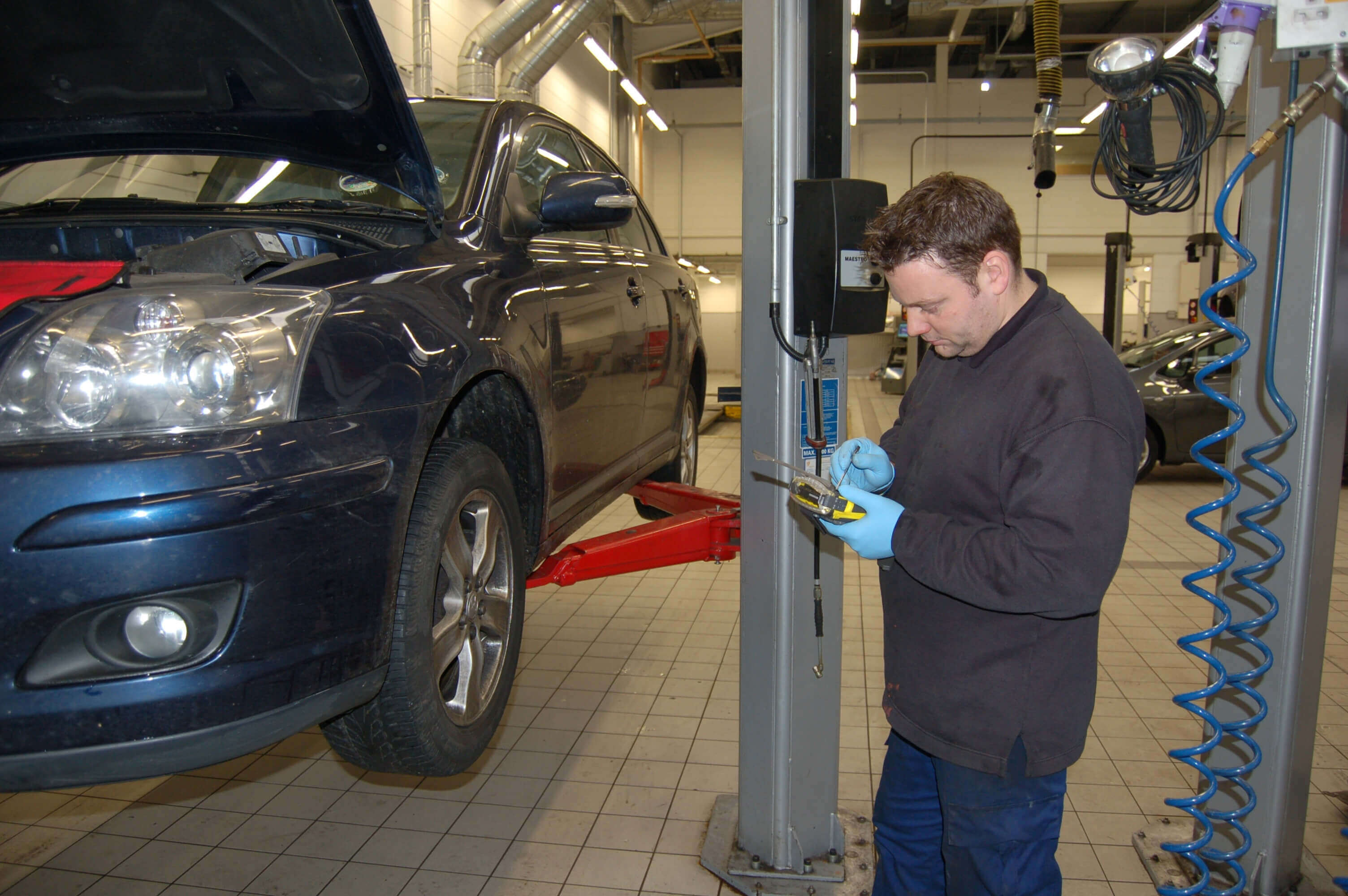 A mechanic working on a car