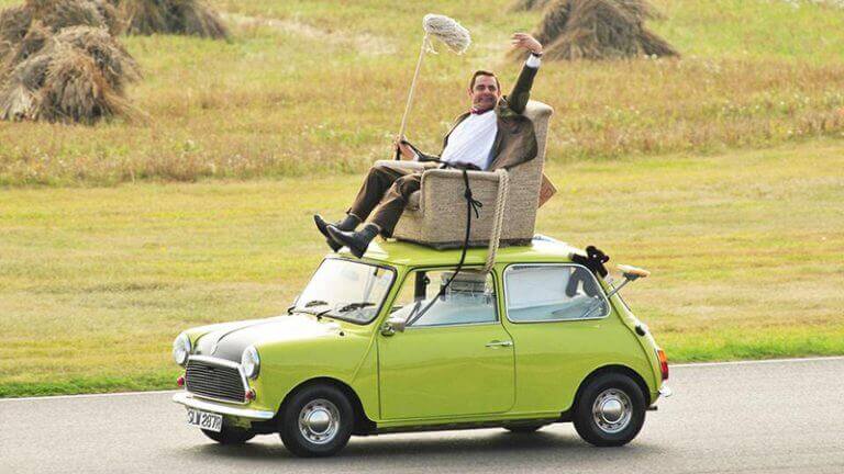 Mr Bean atop his Mini